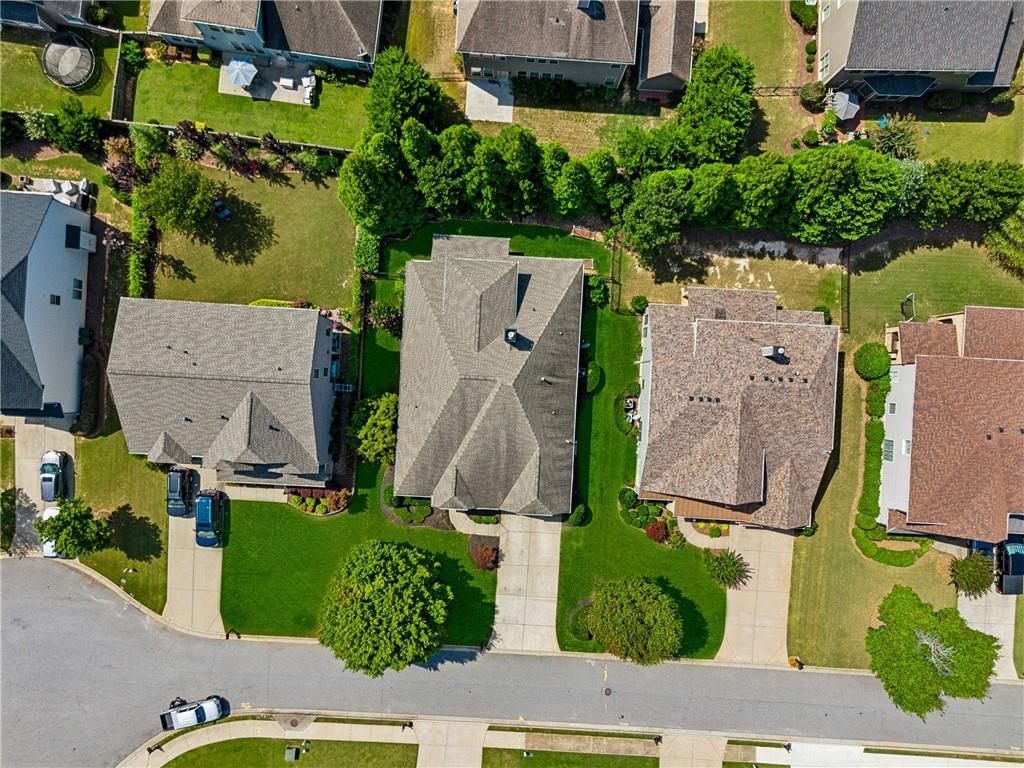 4865 Chase Lane Cumming, GA 30040 - Photo 61 of 70 an aerial view of residential houses with outdoor space