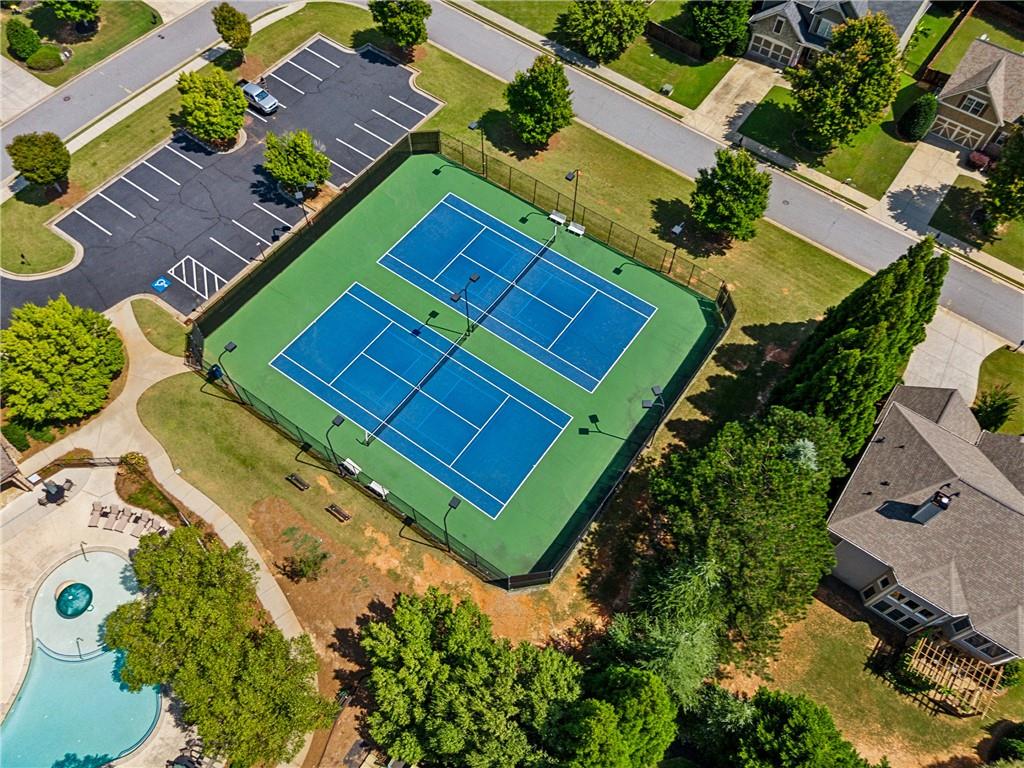 4865 Chase Lane Cumming, GA 30040 - Photo 66 of 70 an aerial view of a tennis ground with a swimming pool