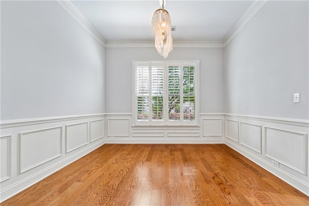 4865 Chase Lane Cumming, GA 30040 - Photo 10 of 70 a view of a room with wooden floor and window