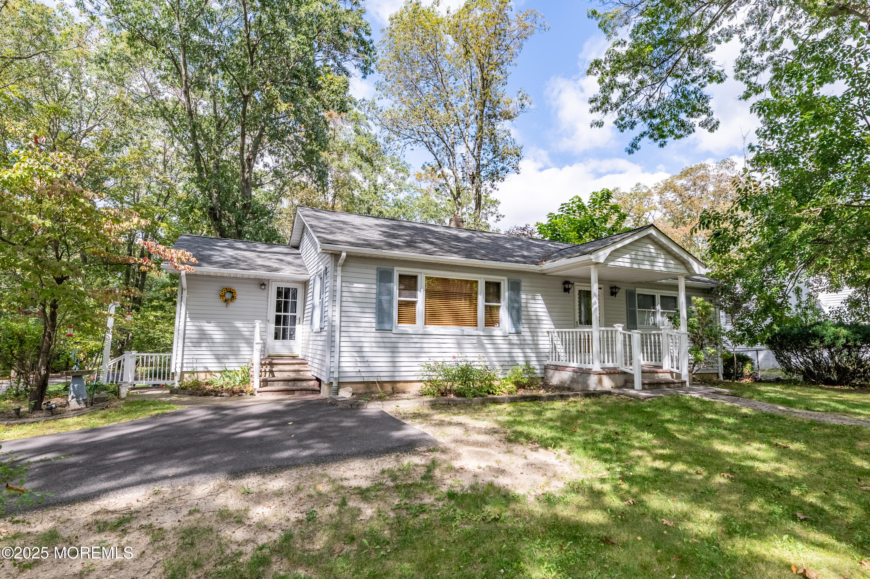 806 West Farms Road Howell, NJ 07731 - Photo 1 of 31 a front view of a house with a yard