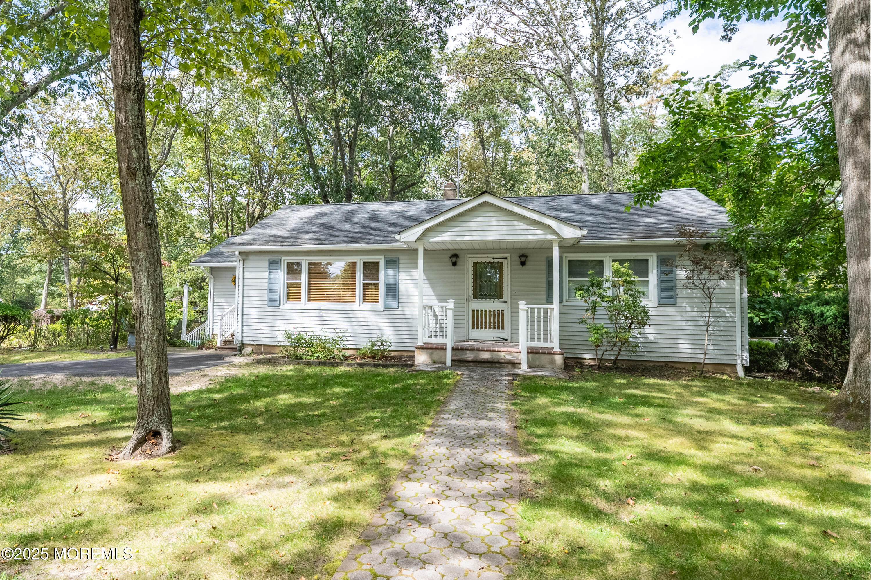 806 West Farms Road Howell, NJ 07731 - Photo 2 of 31 a front view of a house with a yard