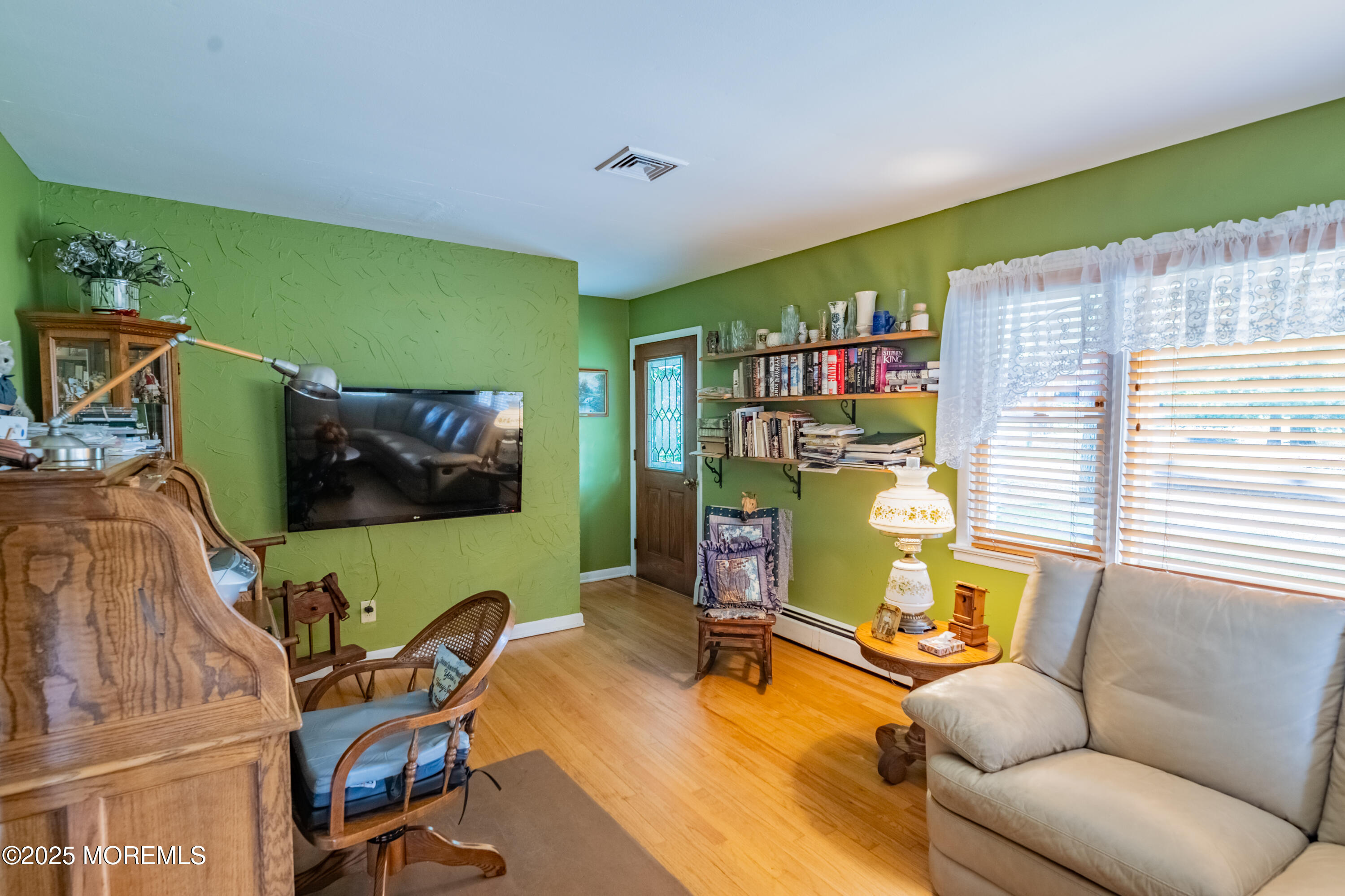 806 West Farms Road Howell, NJ 07731 - Photo 3 of 31 a living room with furniture and a flat screen tv
