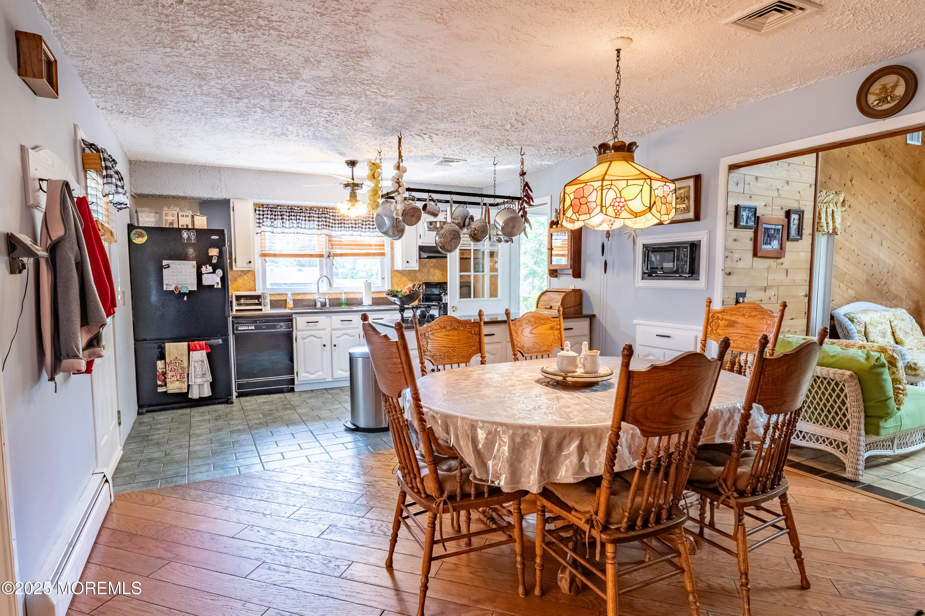 806 West Farms Road Howell, NJ 07731 - Photo 6 of 31 a view of a dining room with furniture and a chandelier