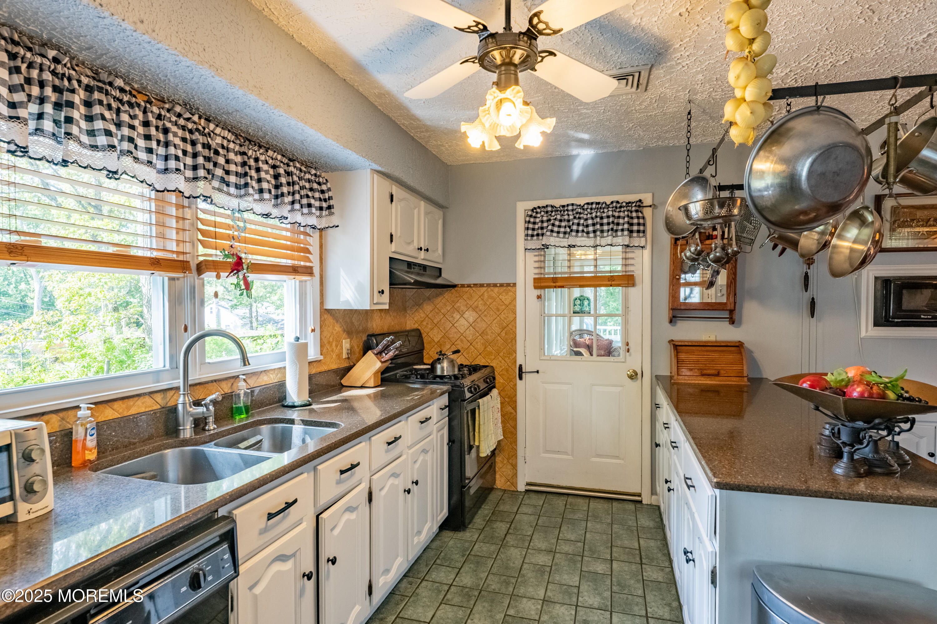 806 West Farms Road Howell, NJ 07731 - Photo 8 of 31 a kitchen with stainless steel appliances granite countertop a sink dishwasher a stove a refrigerator with wooden cabinets and floor