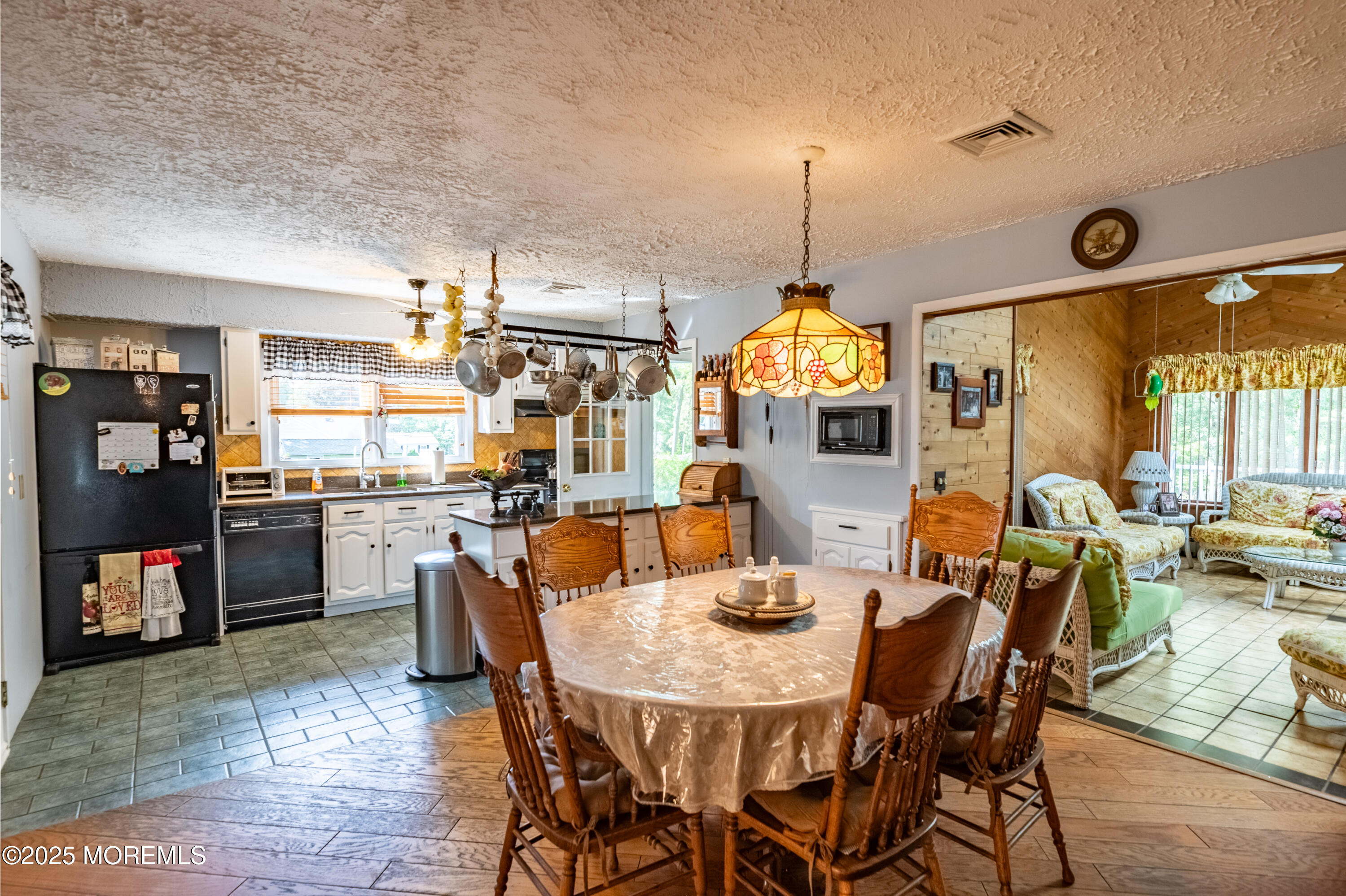 806 West Farms Road Howell, NJ 07731 - Photo 9 of 31 a view of a dining room with furniture and a chandelier