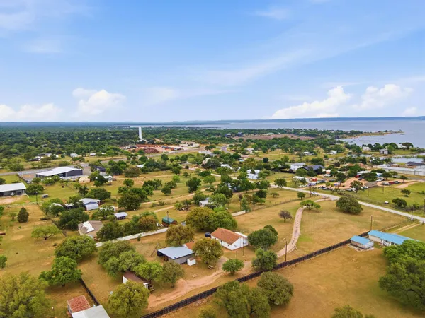 an aerial view of residential building and lake