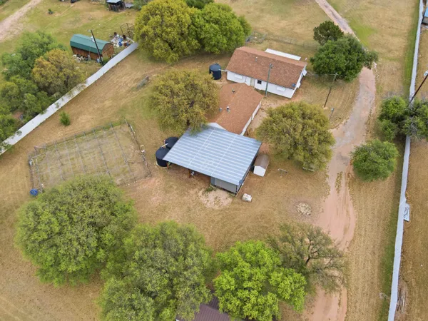 an aerial view of residential house with outdoor space
