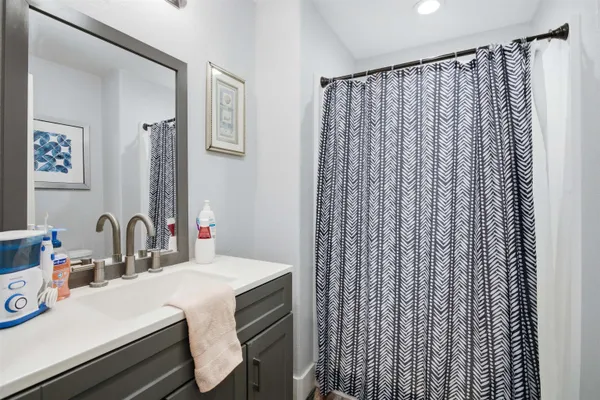 a bedroom with a bed and a view of bathroom