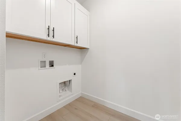 a view of cabinets and wooden floor