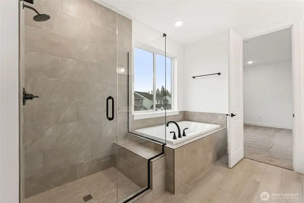 a bath room with a bath tub and a shower