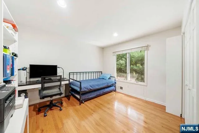 a bedroom with a workspace