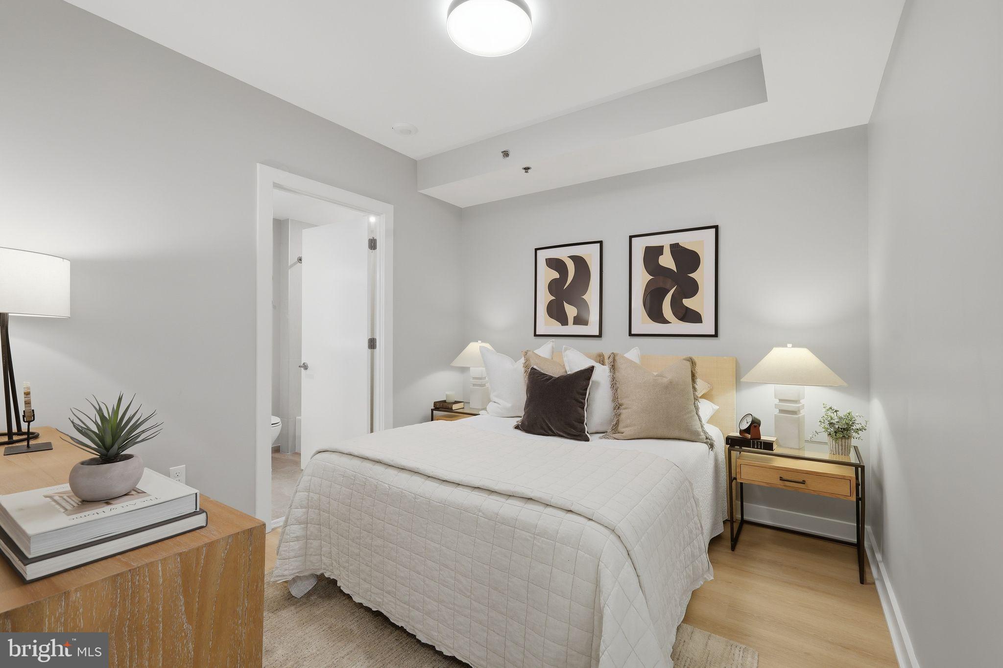 950 3rd Street Northwest, Unit 1009 Washington, DC 20001 - Photo 30 of 32 a bedroom with a bed and a couch