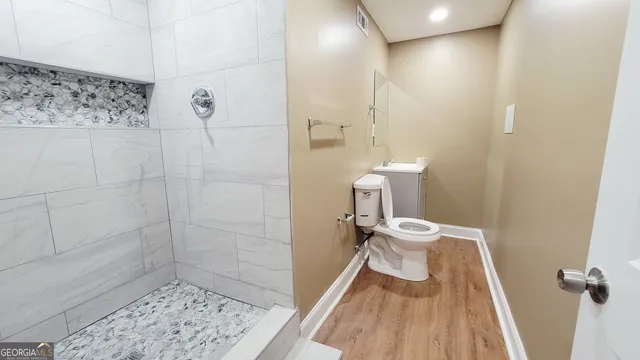a bathroom with a sink and toilet
