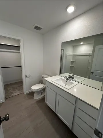 a picture of a bathroom with a shower