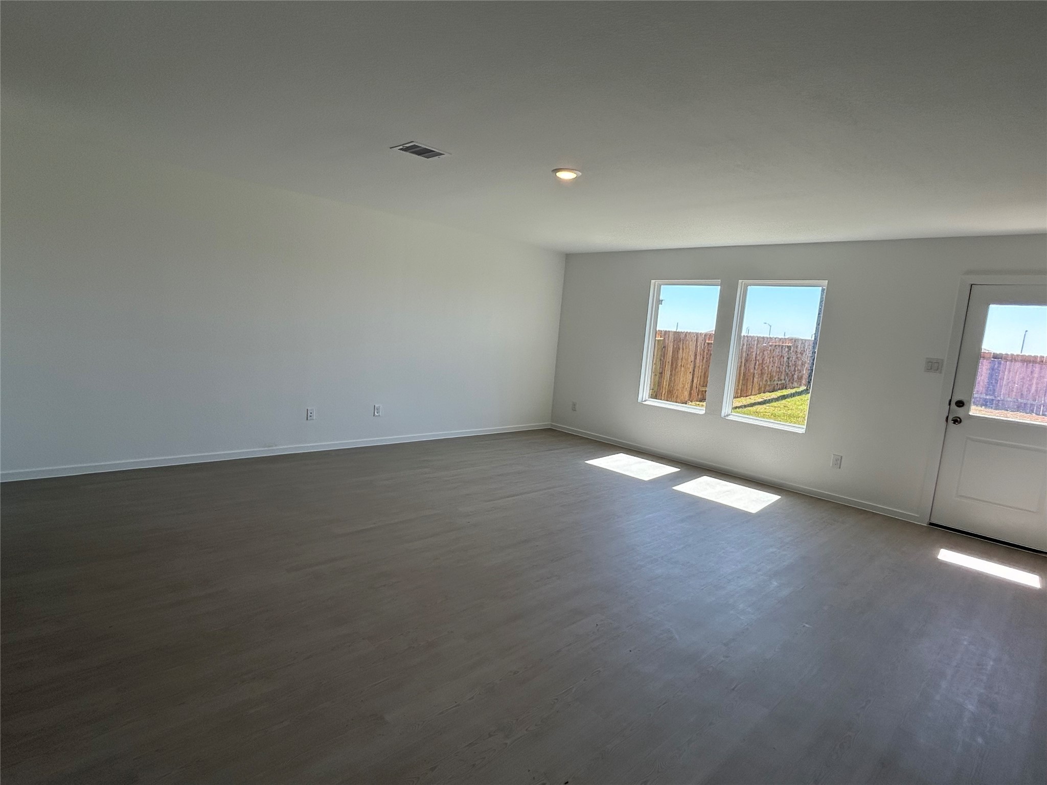 9018 Song Sparrow Way Baytown, TX 77521 - Photo 8 of 21 an empty room with windows