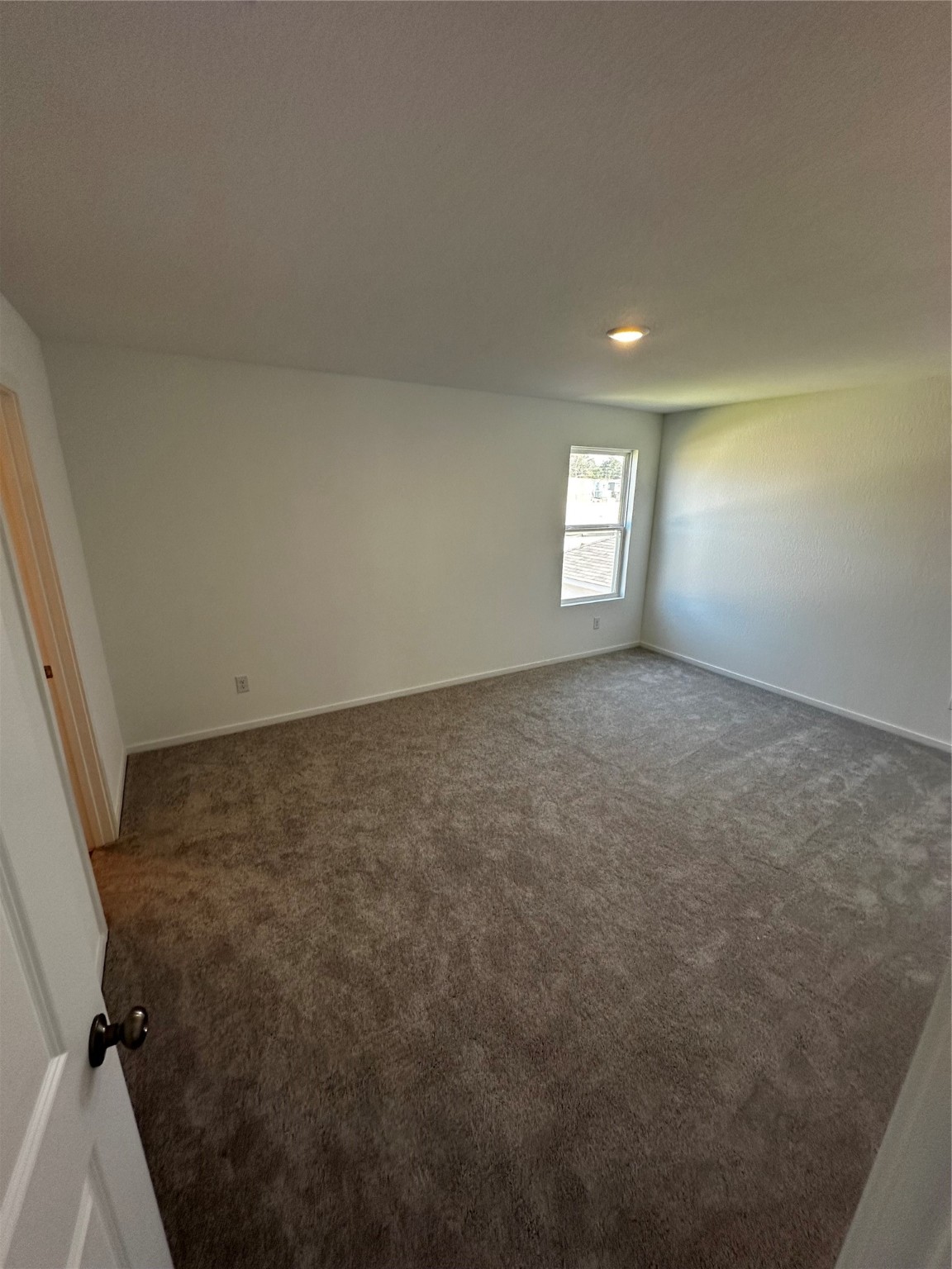 9018 Song Sparrow Way Baytown, TX 77521 - Photo 12 of 21 an empty room with windows