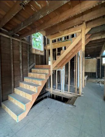 a view of staircase with a white walls