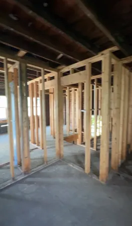 a view of entrance with wooden floor and door