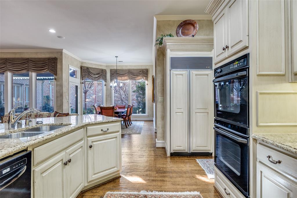 5620 Shubert Court Dallas, TX 75252 - Photo 12 of 32 a kitchen with stainless steel appliances a refrigerator and a sink