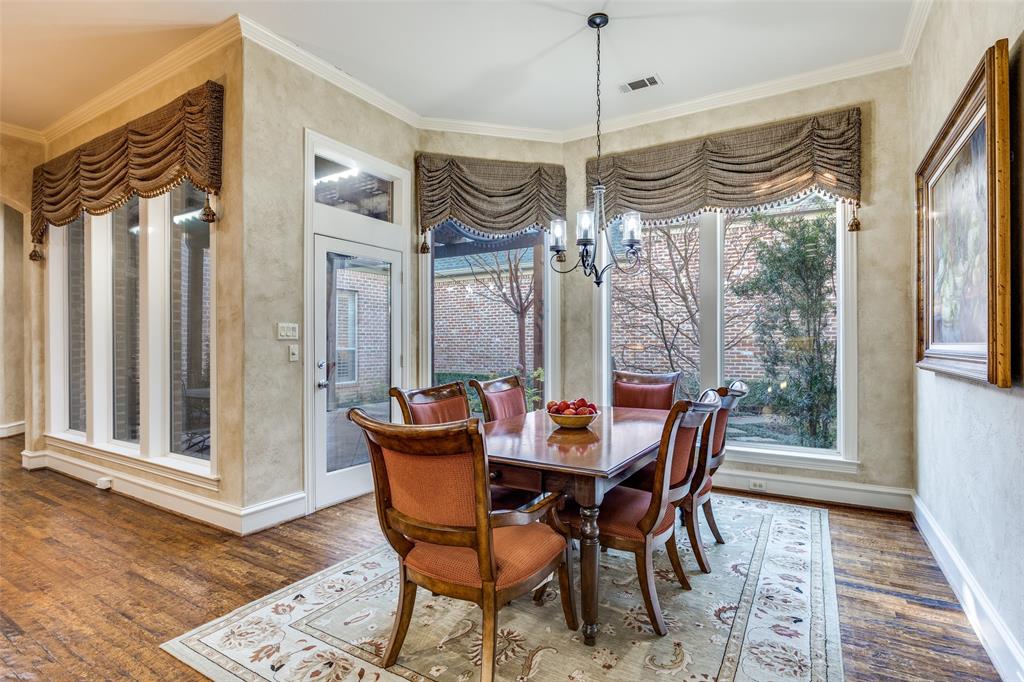 5620 Shubert Court Dallas, TX 75252 - Photo 13 of 32 a view of a dining room with furniture window and wooden floor