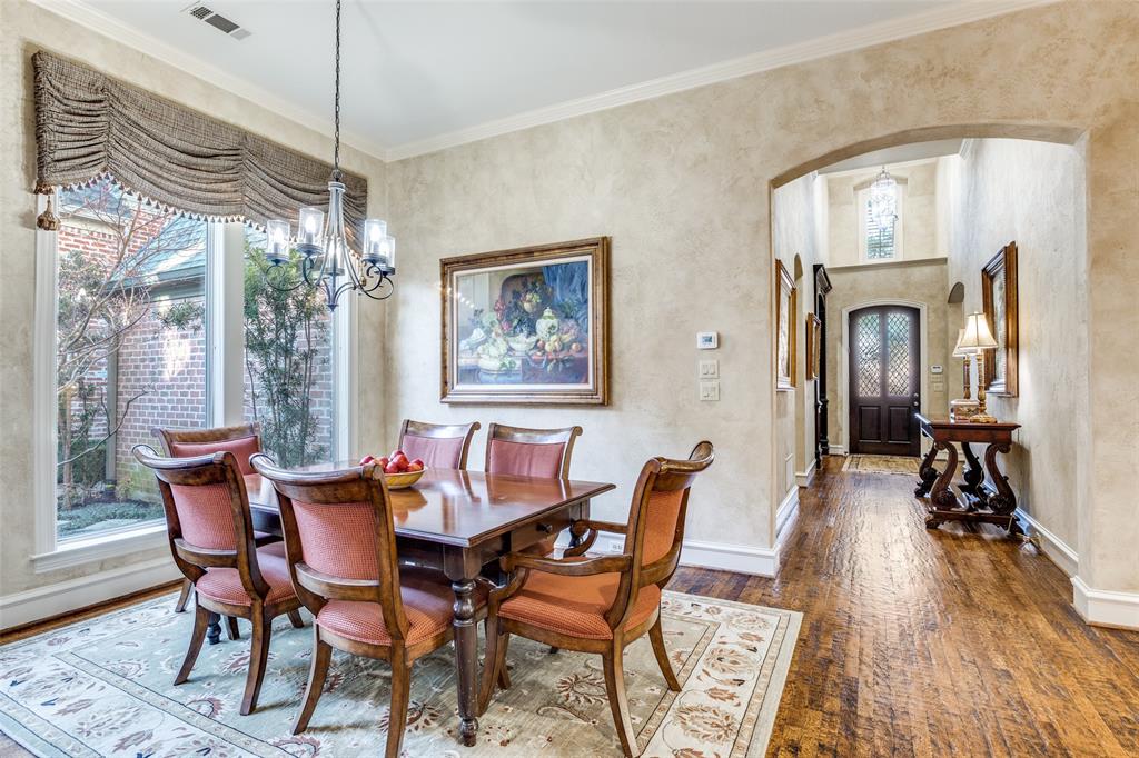 5620 Shubert Court Dallas, TX 75252 - Photo 14 of 32 a view of a dining room with furniture window and wooden floor