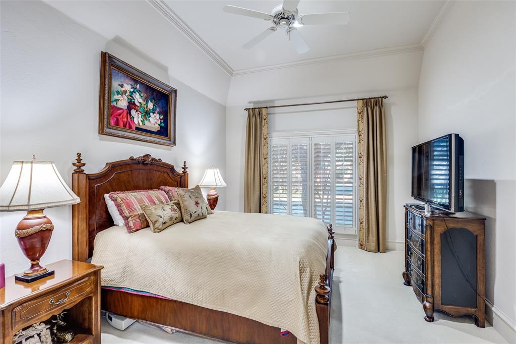 5620 Shubert Court Dallas, TX 75252 - Photo 15 of 32 a bedroom with bed and wooden floor