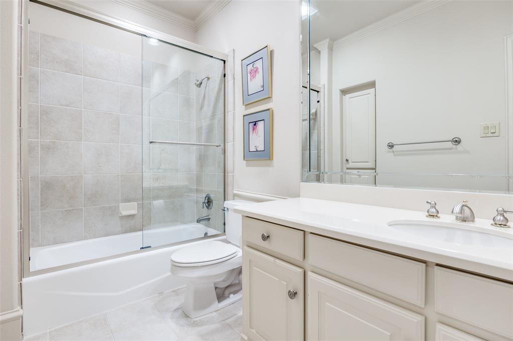 5620 Shubert Court Dallas, TX 75252 - Photo 16 of 32 a bathroom with a sink a toilet and a bathtub