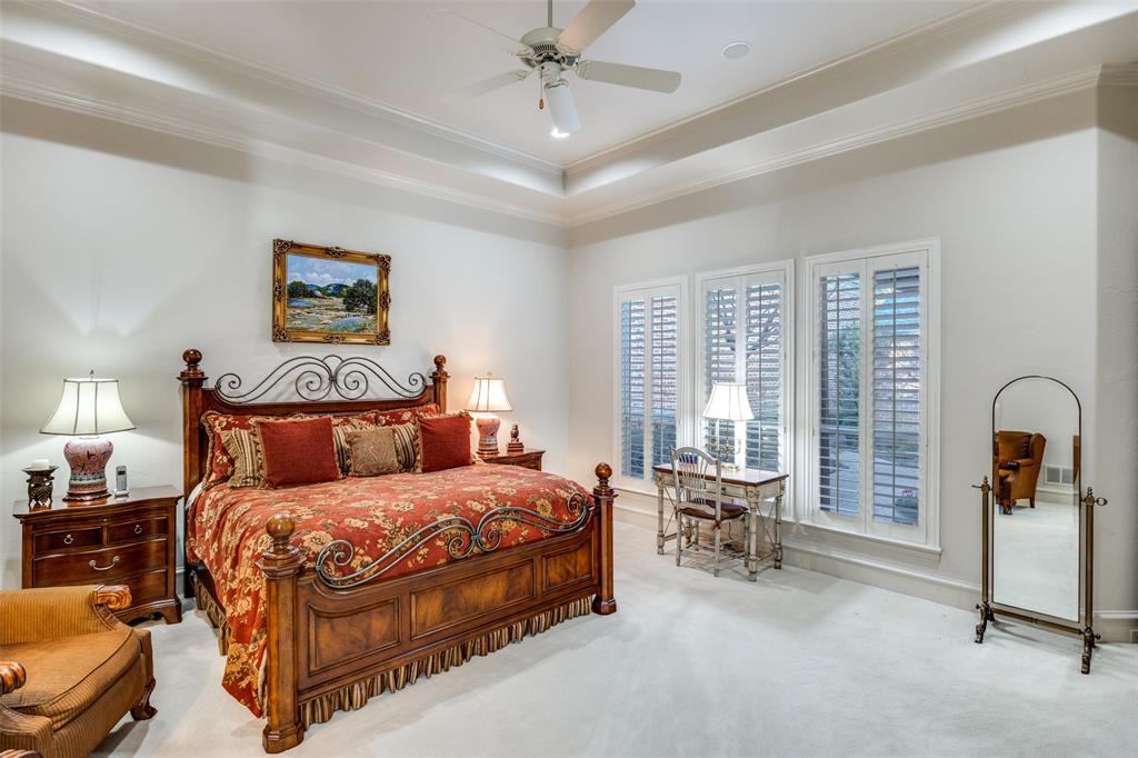 5620 Shubert Court Dallas, TX 75252 - Photo 20 of 32 a bedroom with a bed and a large window
