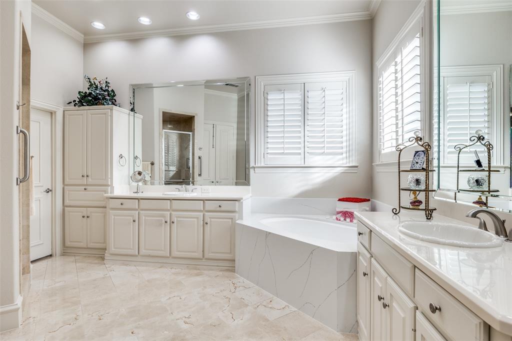 5620 Shubert Court Dallas, TX 75252 - Photo 22 of 32 a bathroom with a granite countertop sink and a bathtub