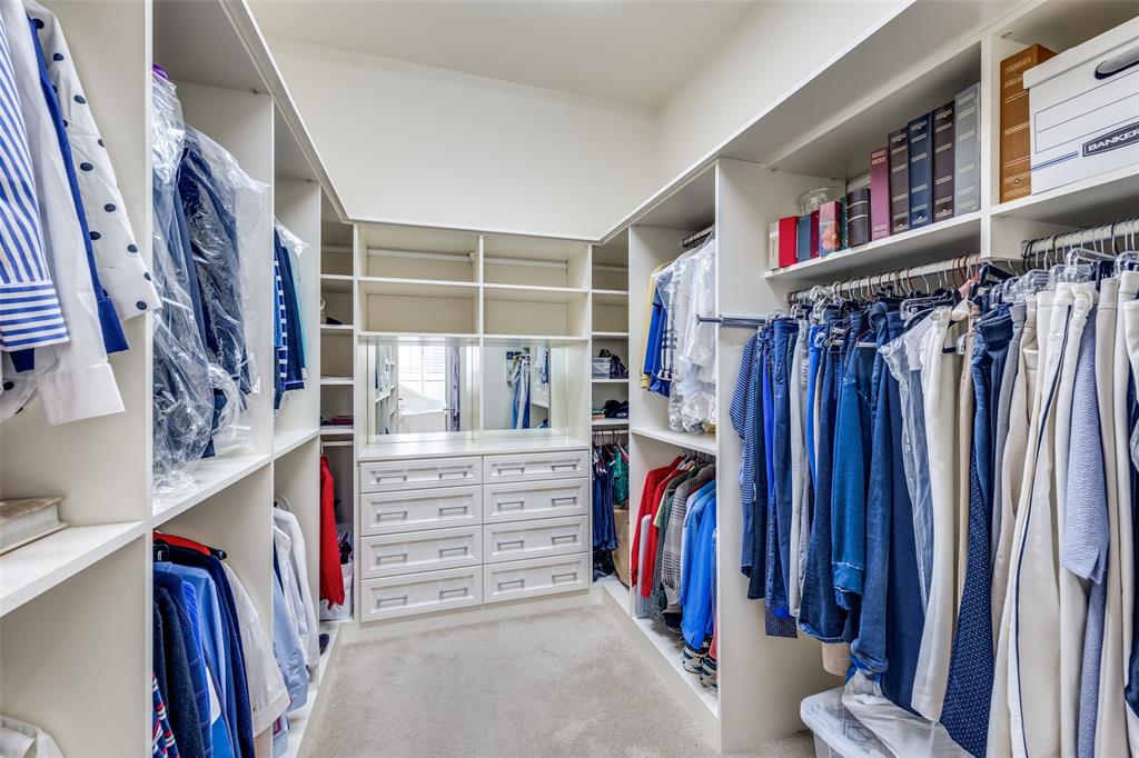 5620 Shubert Court Dallas, TX 75252 - Photo 24 of 32 a view of walk in closet with clothes and shoes