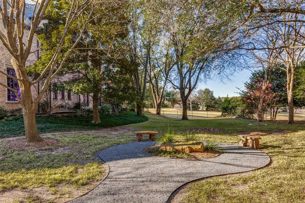 5620 Shubert Court Dallas, TX 75252 - Photo 29 of 32 a view of a lake with houses
