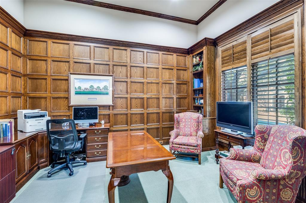 5620 Shubert Court Dallas, TX 75252 - Photo 5 of 32 a living room with furniture a flat screen tv and a window