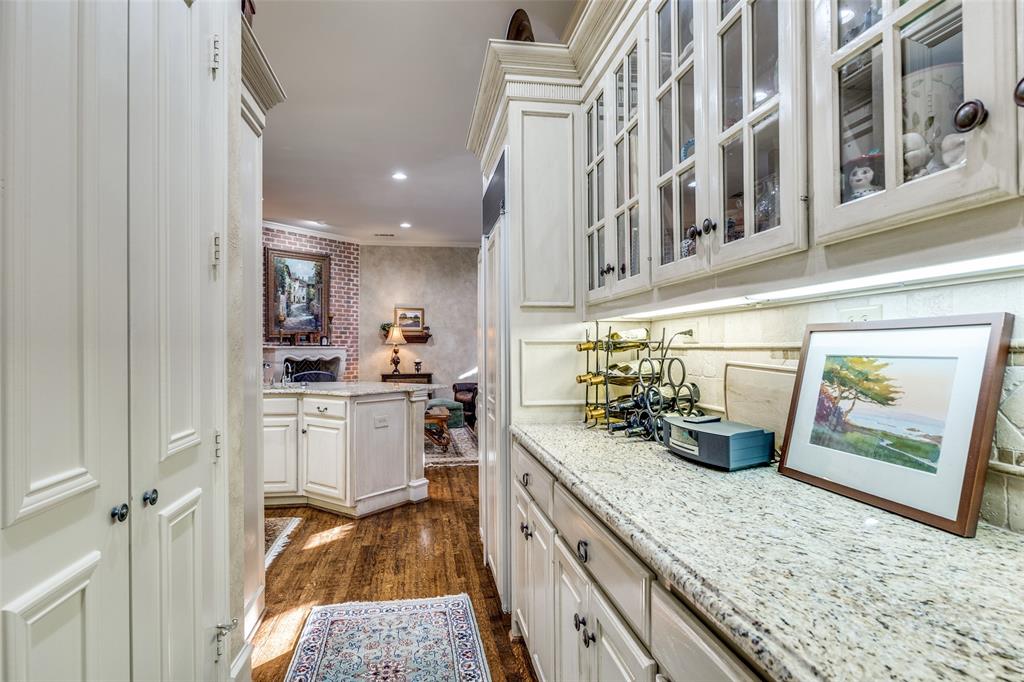 5620 Shubert Court Dallas, TX 75252 - Photo 10 of 32 a kitchen with cabinets and window