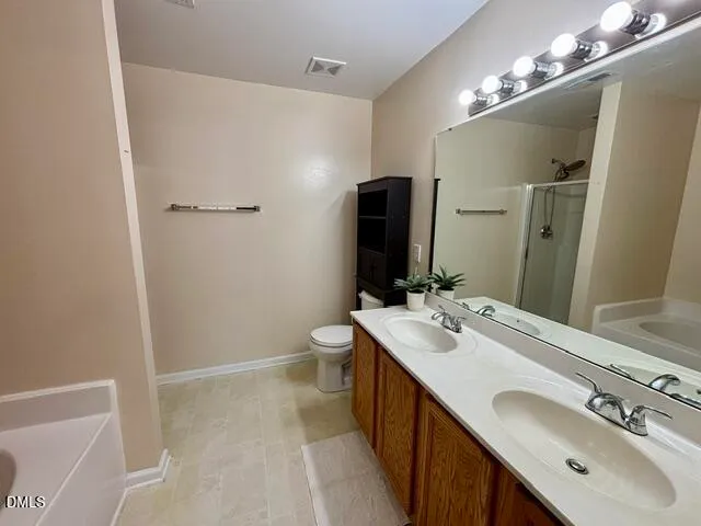 a bathroom with a sink double vanity and a mirror