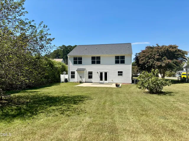 a view of a house with a big yard