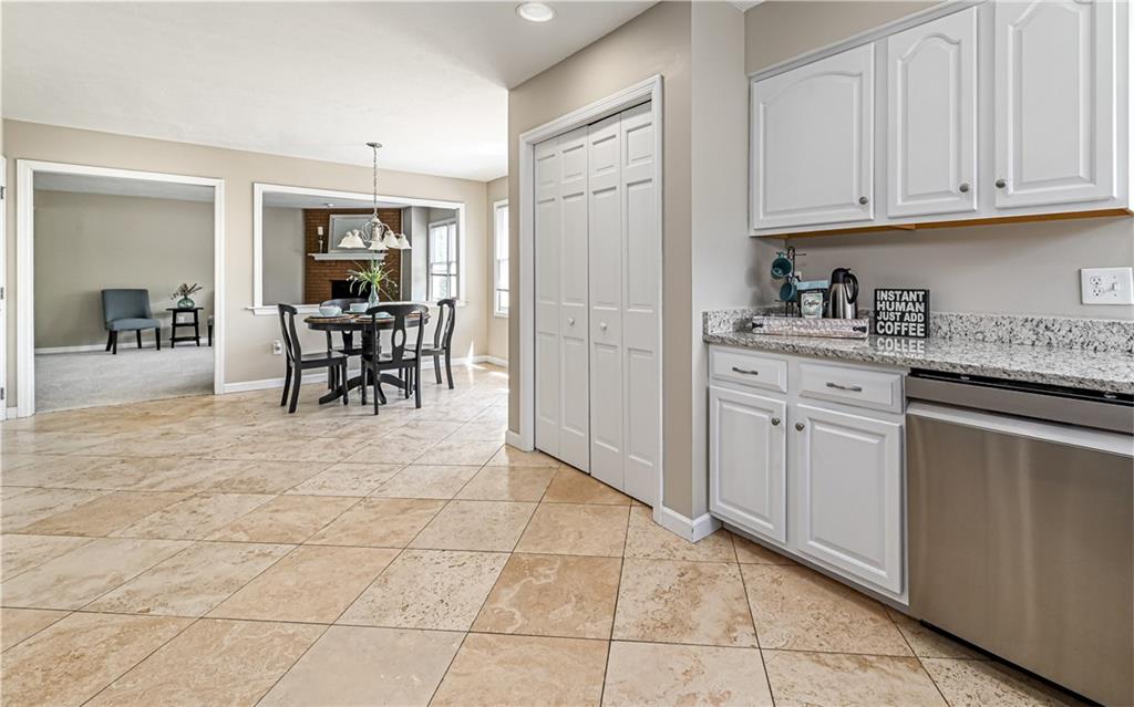 124 Fox Meadow Drive Wexford, PA 15090 - Photo 16 of 37 a kitchen with granite countertop a sink and cabinets