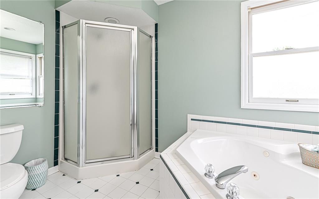 124 Fox Meadow Drive Wexford, PA 15090 - Photo 21 of 37 a bathroom with a bathtub and a toilet