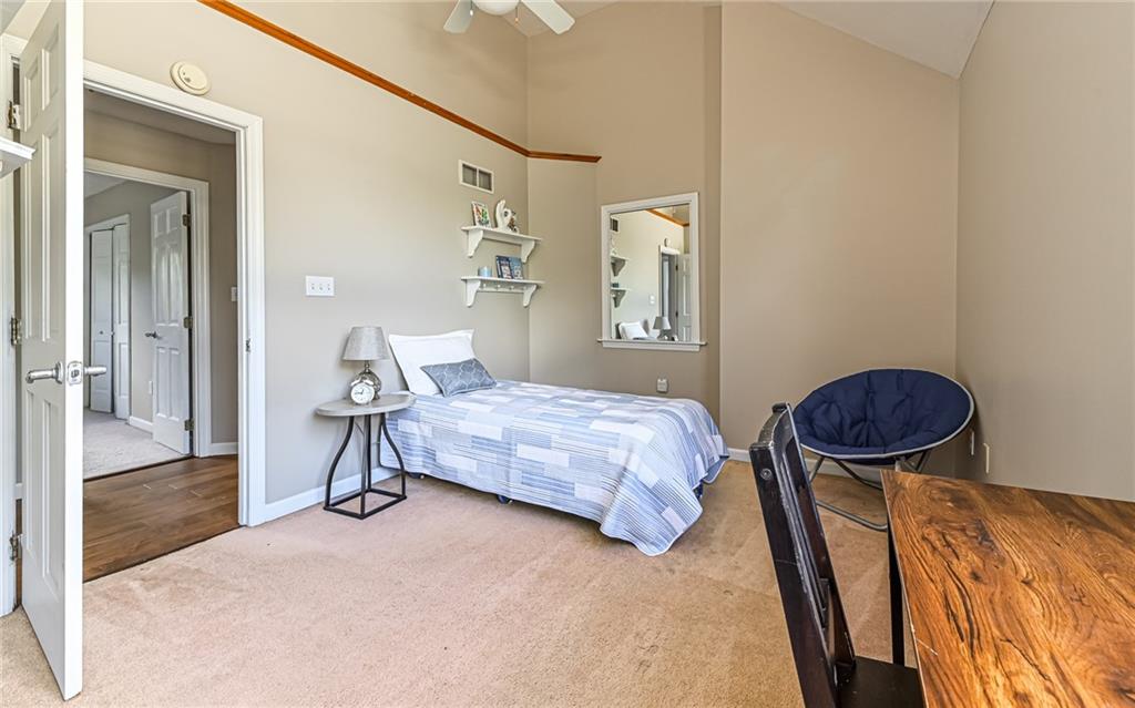 124 Fox Meadow Drive Wexford, PA 15090 - Photo 25 of 37 a bedroom with a bed and a dresser with wooden floor