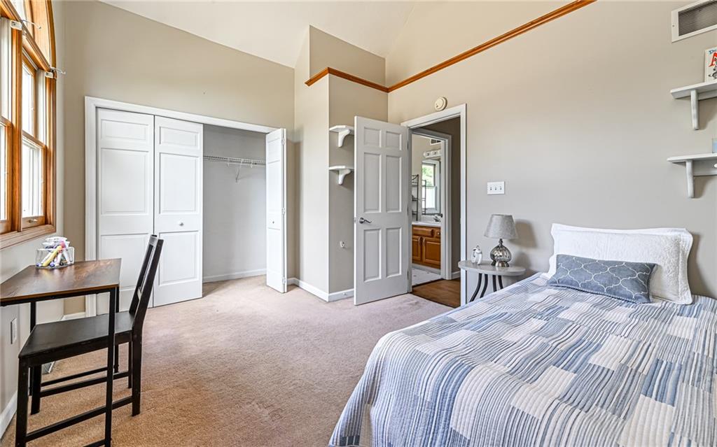 124 Fox Meadow Drive Wexford, PA 15090 - Photo 26 of 37 a bedroom with a bed and a chair