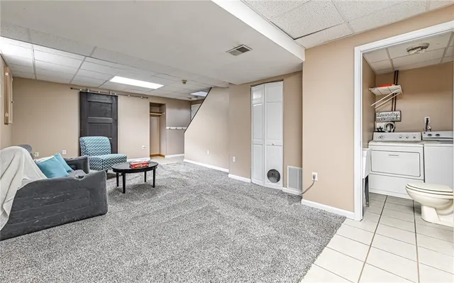 a view of a house with a wooden deck