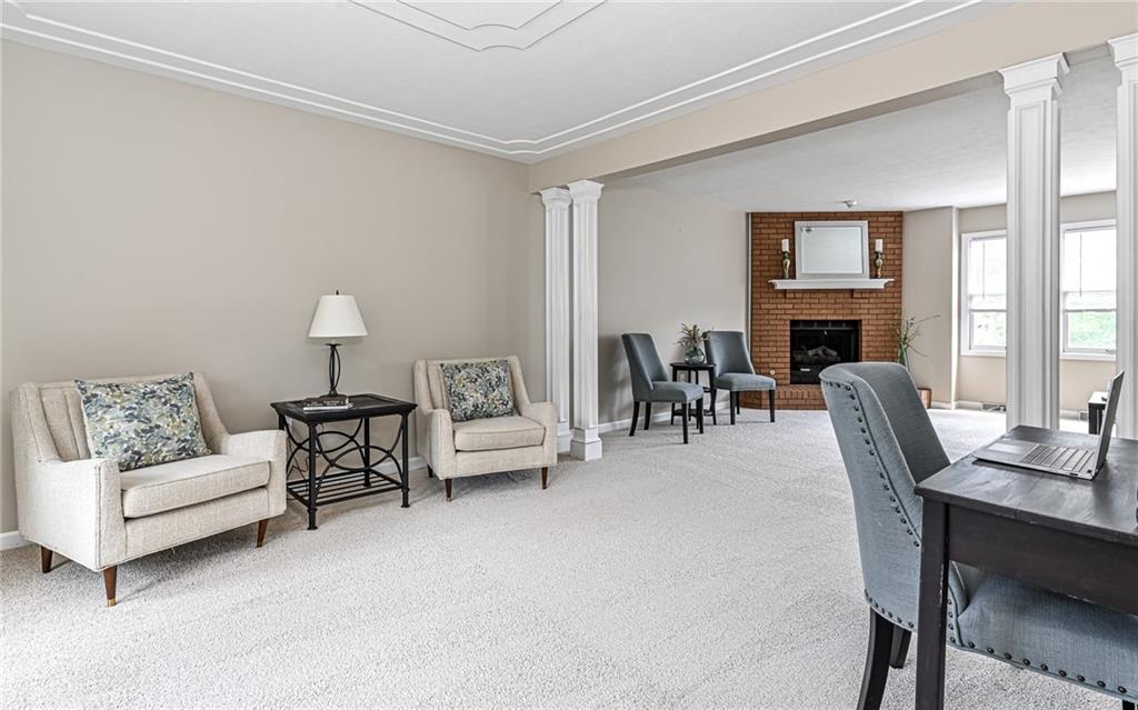 124 Fox Meadow Drive Wexford, PA 15090 - Photo 5 of 37 a living room with furniture and a fireplace