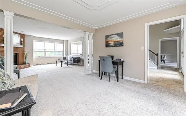 a view of a livingroom with furniture and a window