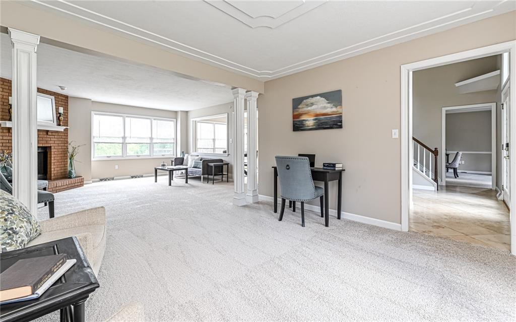 124 Fox Meadow Drive Wexford, PA 15090 - Photo 6 of 37 a living room with furniture and a flat screen tv