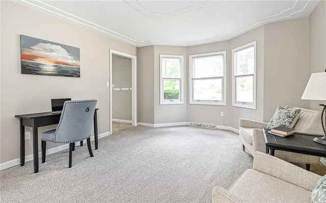 a view of a livingroom with furniture and fireplace