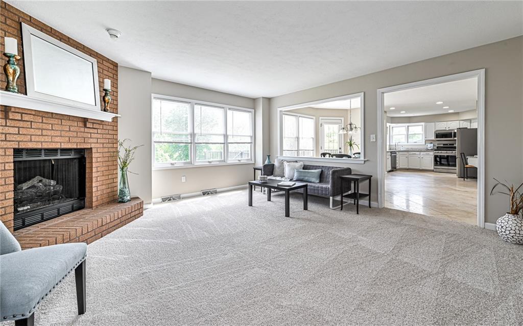 124 Fox Meadow Drive Wexford, PA 15090 - Photo 8 of 37 a view of a livingroom with furniture and fireplace