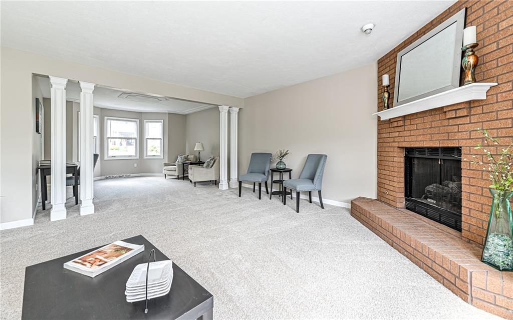124 Fox Meadow Drive Wexford, PA 15090 - Photo 10 of 37 a living room with furniture and a fireplace