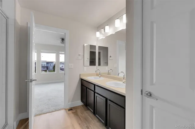 a bathroom with a glass shower door