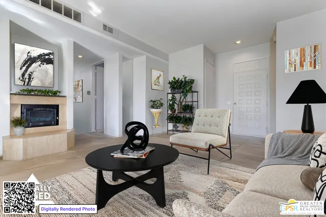 a living room with furniture a rug and a fireplace