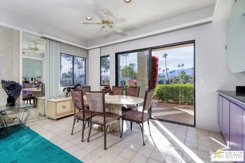 a view of a dining room with furniture window and outside view