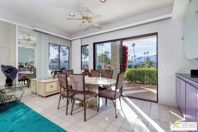 a view of a dining room with furniture window and outside view